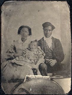 Image of a black parents and their child