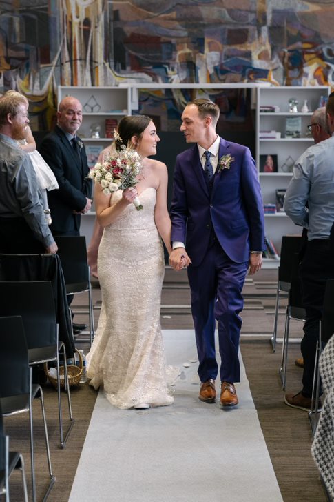 Two people getting married at Central Library