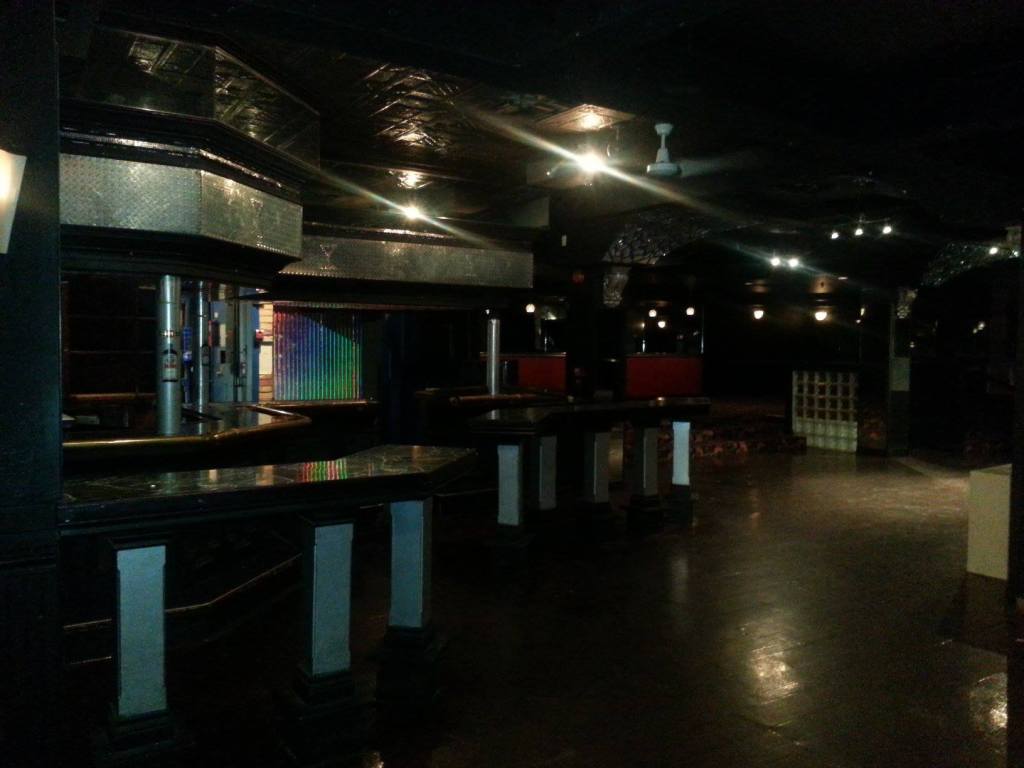 A photo inside Club Renaissance after it closed for business in 2013. The bar, tables, lounge, DJ booth and dancefloor are visible.