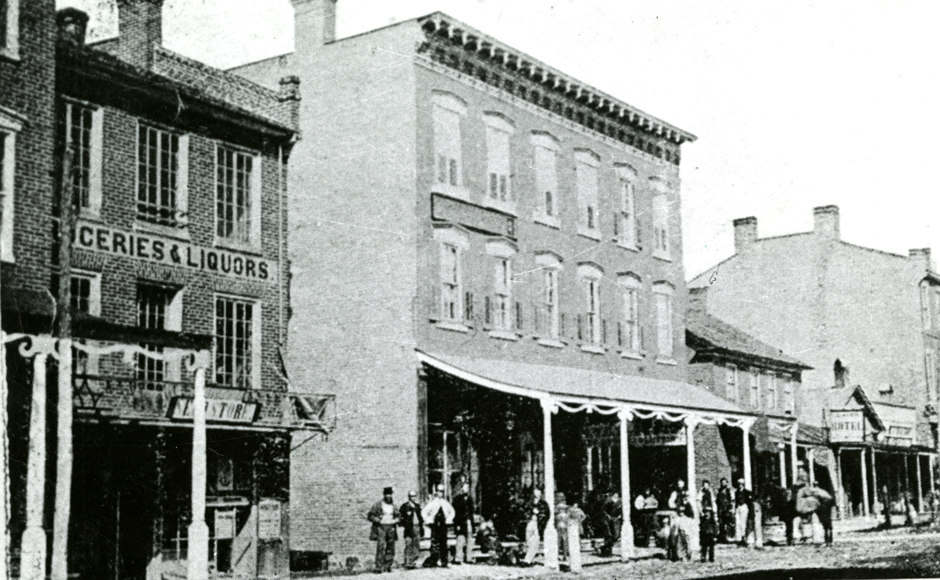 Black and white photograph of King Street, near Foundry Street, showing the Red Lion Inn Hotel and adjacent stores, ca. 1865
