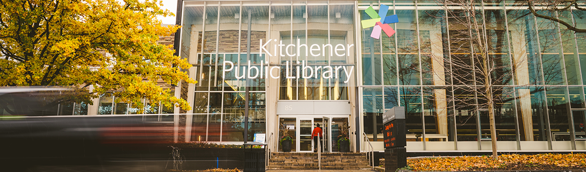 A photograph of the glass exterior of a KPL library building